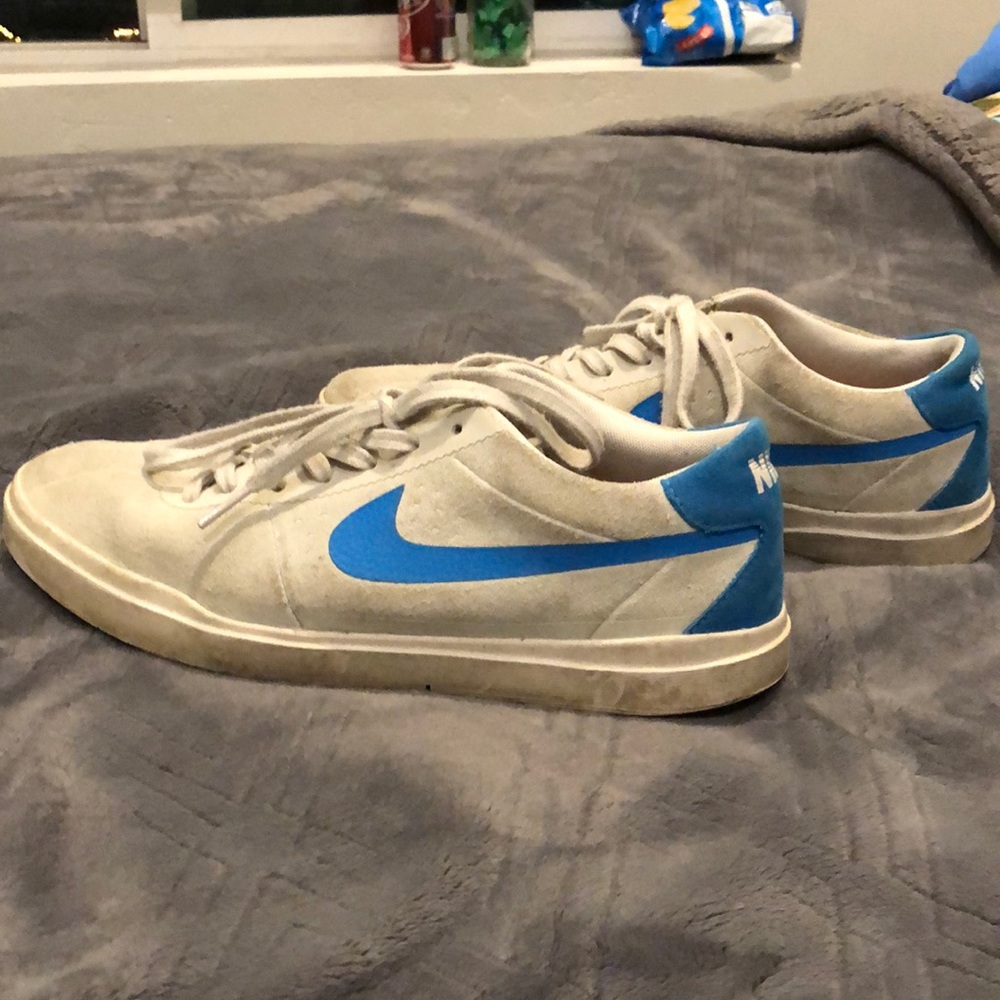 Blue and white Nike shoes